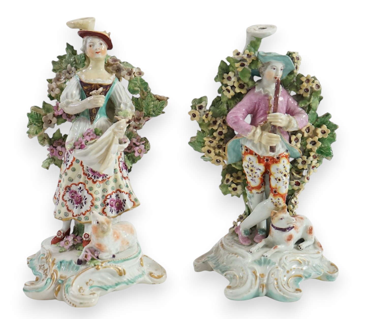 A pair of Derby candlestick groups of a shepherd and shepherdess, c.1775